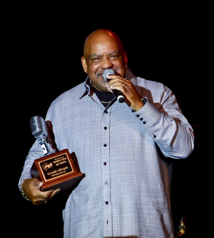 Gerald Albright, a jazz festival favorite, accepts the Artist of the Year Award on Oct. 17, opening night of the 30th annual Rehoboth Beach Jazz Festival, at Cape Henlopen High School. RON MACARTHUR PHOTO