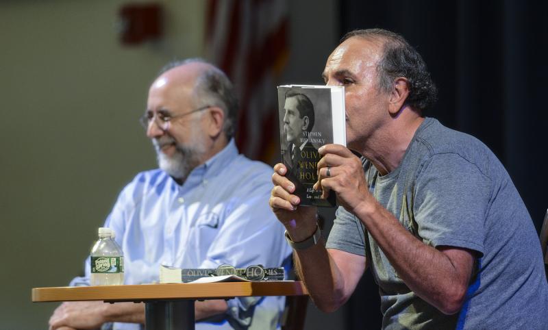 Ronald Collins, right, shares some humor with author Stephen Budiansky about Supreme Court Justice Oliver Wendell Holmes.
