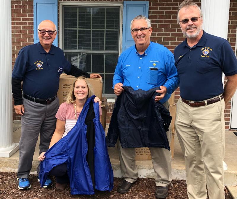 Standing with the winter coat donations are (l-r) Peter Polo, Knights of Columbus Star of the Sea Council 7297 chancellor; Shawna Steinman, Cape district homeless liaison administrative assistant; David McDowell, Cape district homeless liaison; and Mark Petrusic, Knights of Columbus. SUBMITTED PHOTO