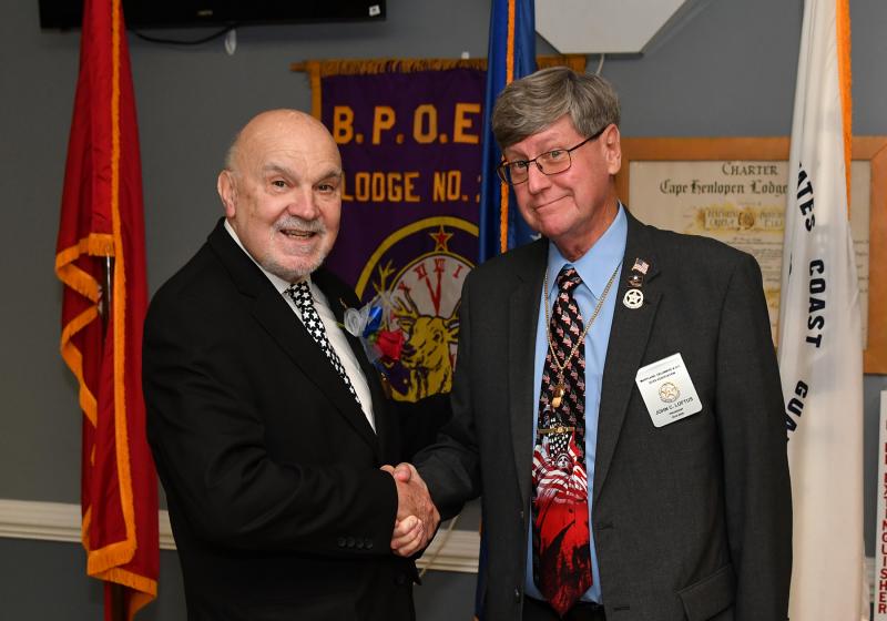 Elks Lodge 2540 Exalted Ruler Ralph E. Patterson, left, welcomes John Loftus, president of the Maryland, Delaware and D.C. Elks Association.