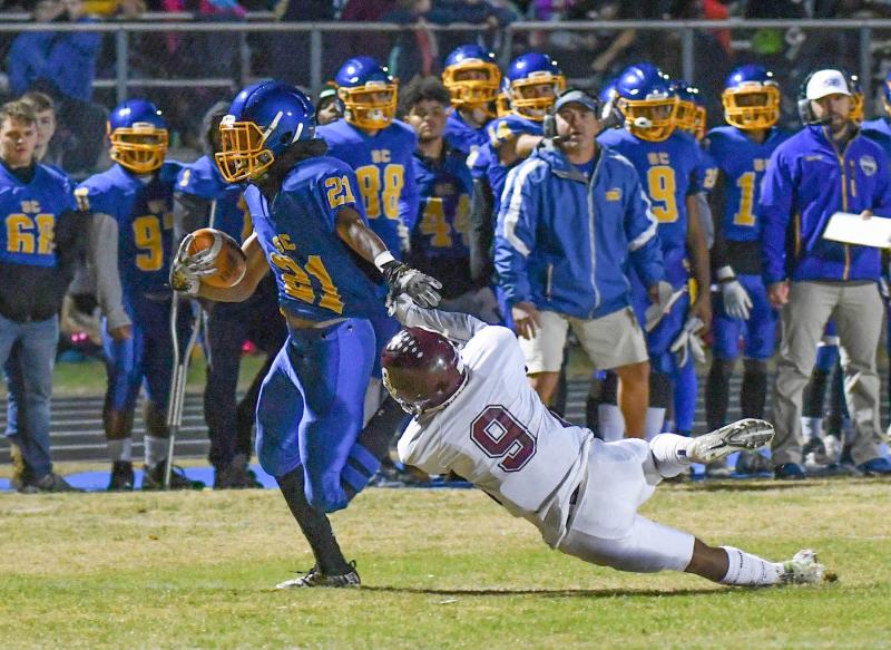 Central’s TyJhir Sheppard-Parker runs out of the grasp of Concord’s Roshaun Jackson and scores a 33-yard touchdown in the 21-17 win over the Raiders. DAN COOK PHOTOS