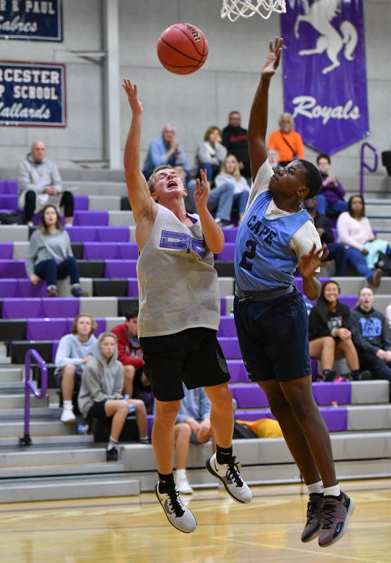 Royals guard Seth Stevens, left, lays one in and is fouled by Cape’s Ja'Vaughn Brton.