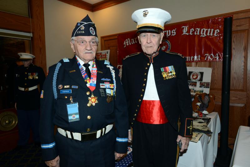 Korean War Veterans Association Chapter 1 Past President Walter Koopman joins Captain Tom Terrell, retired, in front of Terrell’s collection of WWII memorabilia. Marines Celebrate 244th Birthday