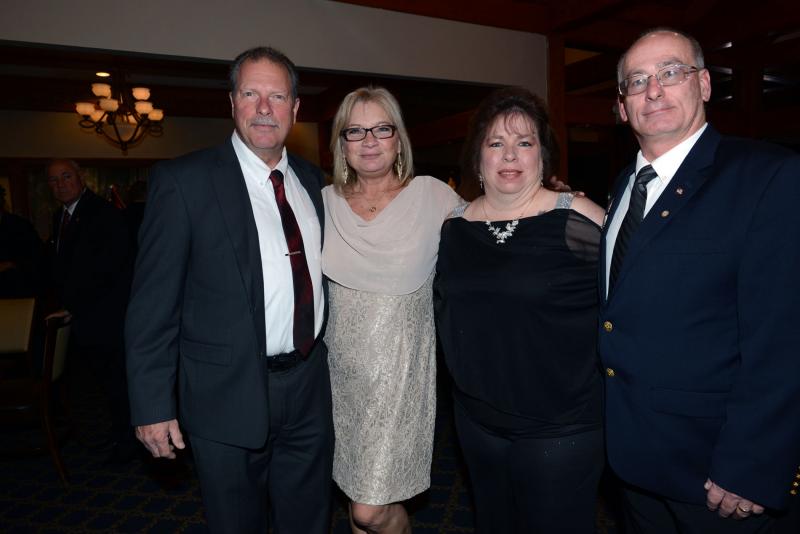 Guests from American Legion Post 28 gather for a photo. Shown (l-) are 3rd Vice Commander Russ Bufflap, Marie Bufflap, Donna Miller and Sons of American Legion Squadron 28 Commander Garth Miller. Marines Celebrate 244th Birthday