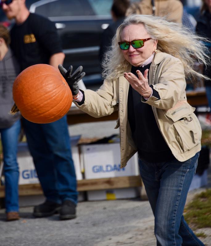 After trying to pick a miniature pumpkin, organizers made Vicky Pritchet toss a regulation-size pumpkin, which she tossed 8-feet-9-inches.