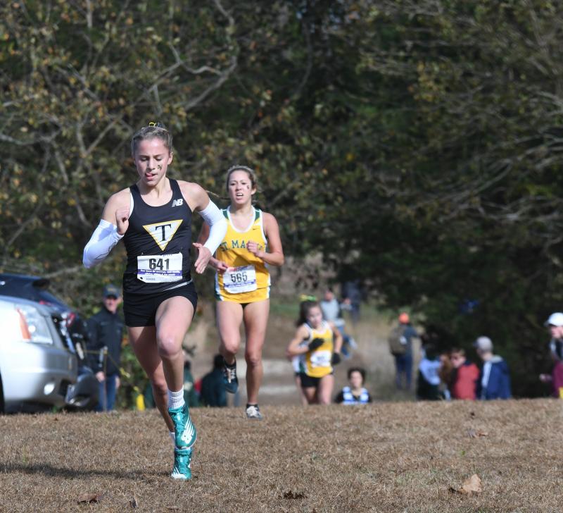 Lydia Colasante of Tatnall (18:48) sprints to finish ahead of Tiffany Herrera of Saint Mark’s (18:53).