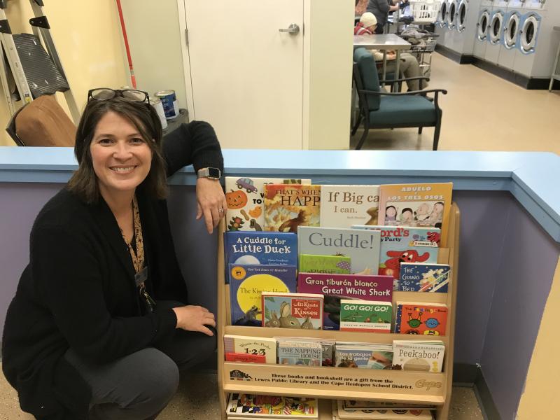 Lewes Public Library Children’s Librarian Jennifer Noonan perused the Bookmobile warehouse to select books for the laundromat reading shelf. SUBMITTED PHOTOS