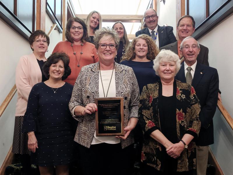 The Improving Safe Practices with the Administration of Moderate Sedation Team won a 2019 Quality and Safety Award. Shown are in back (l-r) Amanda Kenney; April Ahlers, RN; Rick Schaffner, RN, interim CEO, executive vice president, and COO; and Stephen Fanto, MD, board of directors. In the middle are Kathy Podbesek, MSN, RN-BC; Susan Mross, RN, CNIV; Amy Linzey, BSN, RN; and David Herbert, board of directors chair. In front are Holly Heilner, BSN, RN, CPHQ, CSSGB; Liz Zehner, RN; and Barb Moulinier, MA, HACP.