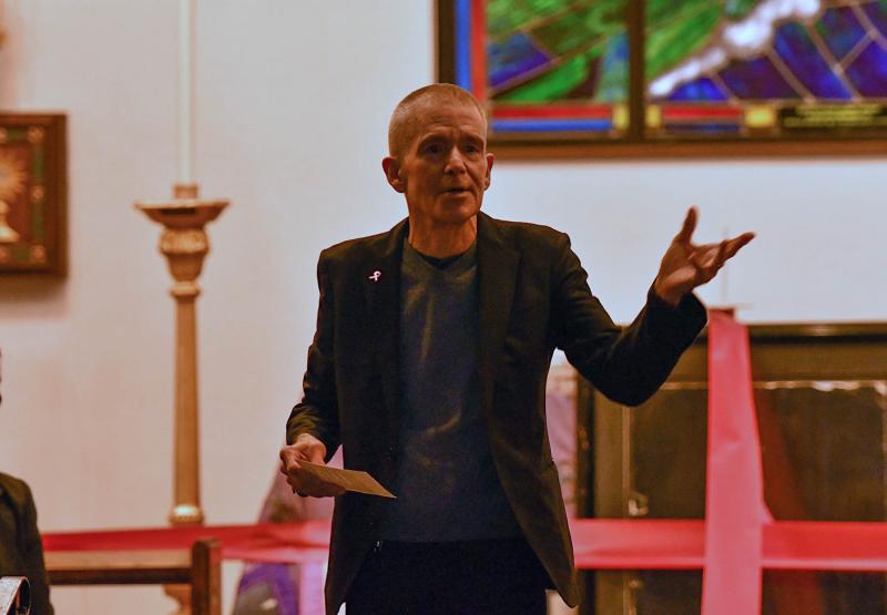 CAMP Rehoboth founder Murray Archibald wrapped the observers with a wide red ribbon and said the red ribbon ties us together into community, and despite our differences, we are one. He ended the service with a charge to “go take your light into the world.”