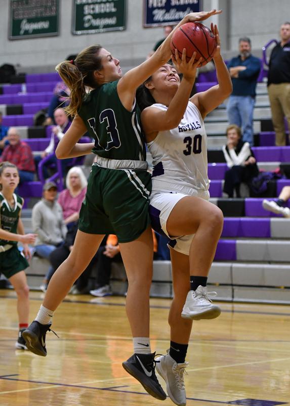 Royals senior Mara Agapito, right, gets blocked by Gunston’s Annabelle Gillespie.