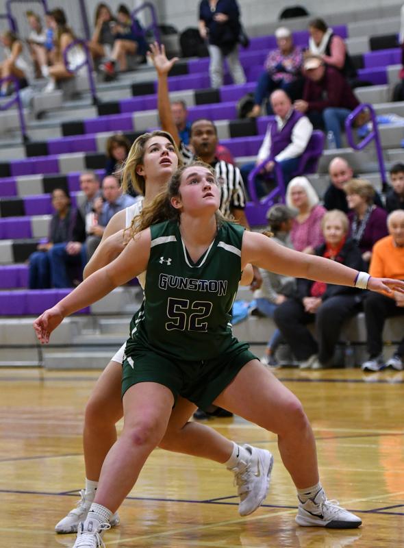 Gunston forward Lucy Bamford boxes out Delmarva Christian’s Kandice Schlabach.