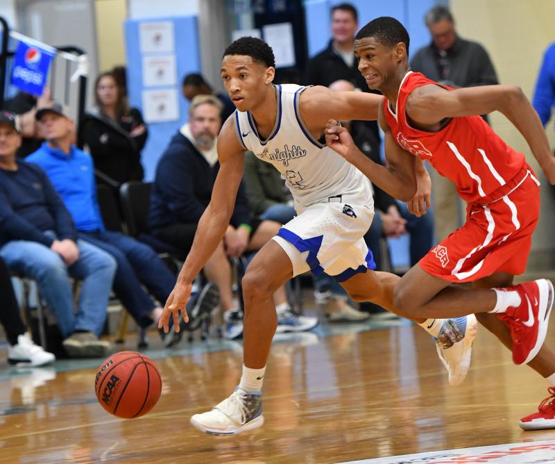 Gill St. Bernard’s player Denver Anglin heads upcourt on a fast braak against National Christian Academy.