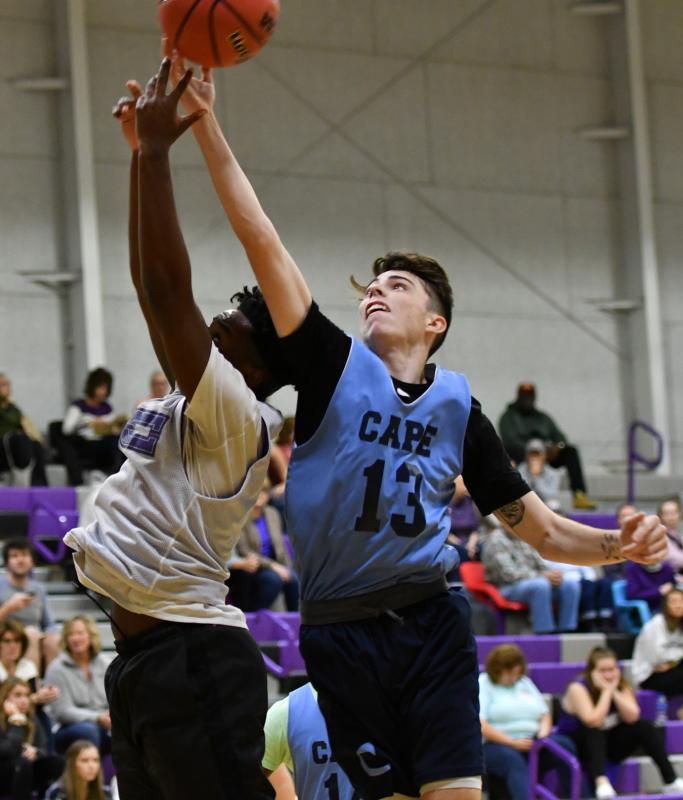Cape’s Collin Mallet, right, battles for a rebound with Royals guard Jeremiah Hannah.