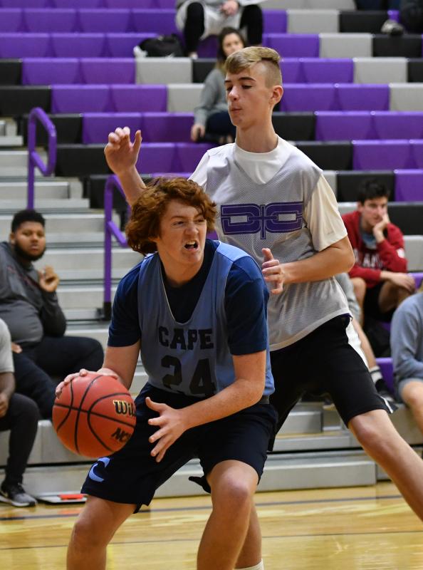 Cape’s Dylan Fannin goes to the paint on Royals forward Carter Breasure.