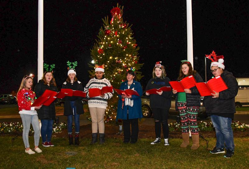 Singing Christmas carols are members of the Millsboro Middle School Treble Choir. Shown are (l-r) Mallori Stevenson, Allie Wheatley, Kayla Belfont, Kassi Timmons, Director Stephanie Buchert, Nataleigh Moore, Sammy Buckley and Kirra Bruch.