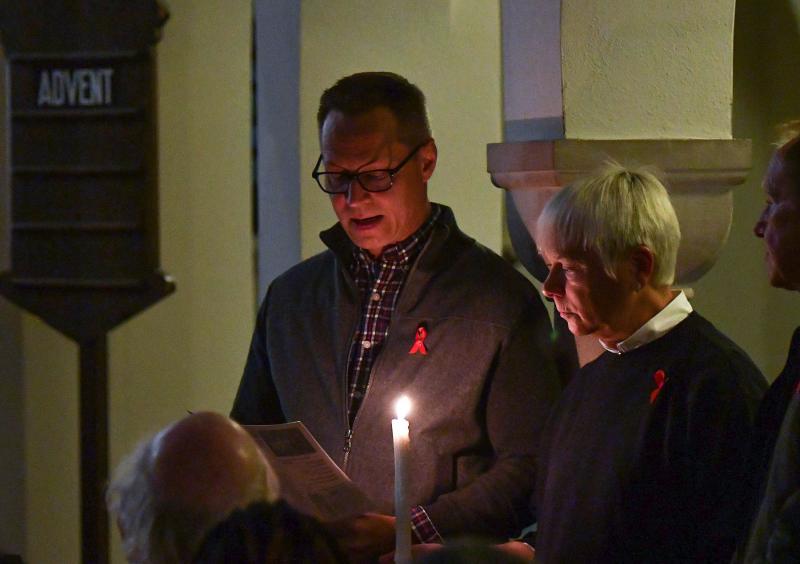 CAMP Rehoboth Board President Chris Beagle and Cathin Bishop read names during the service of remembrance.