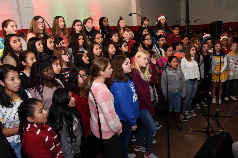 The Georgetown Middle School Combined Choir takes the stage to sing “The Christmas Song.”