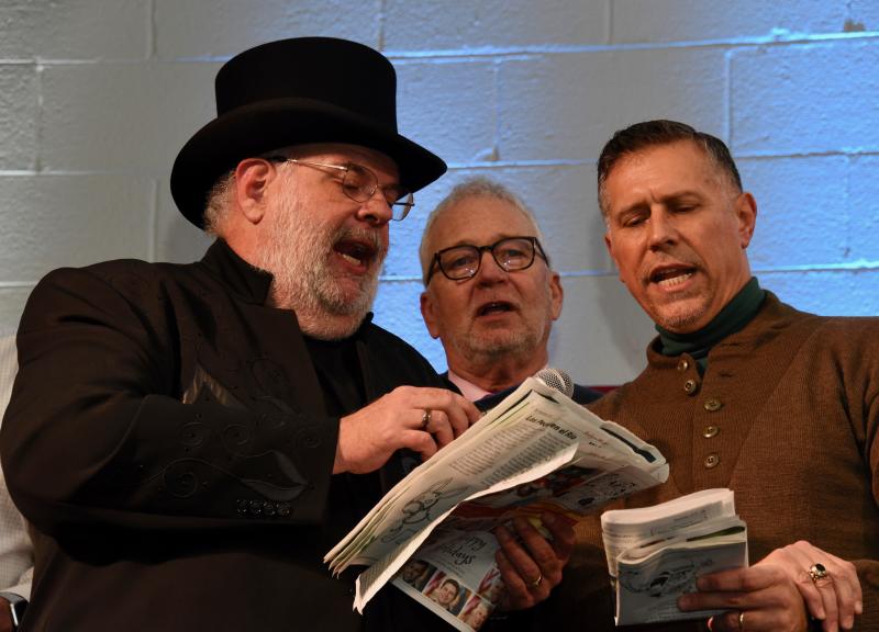 Kevin Short, Sussex County Councilman Irwin “I.G.” Burton of Lewes and Rep. Steve Smyk of Milton join with other distinguished guests to lead the crowd in “Jingle Bells.”