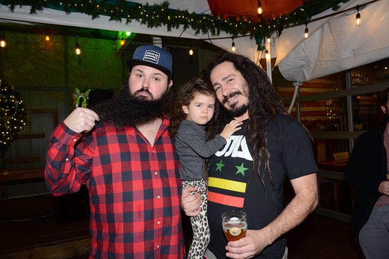 Event organizers Morgan Shank, left, and Orion Cameron are joined by Irie Cameron. Shank has three years of beard growth and Cameron has 12 years of dread growth. Buzz Off Cancer