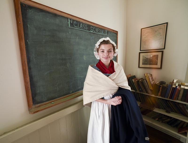 Allison Marie McCarron looks ready to impart a lesson in the historic School House at the LHS historic campus.