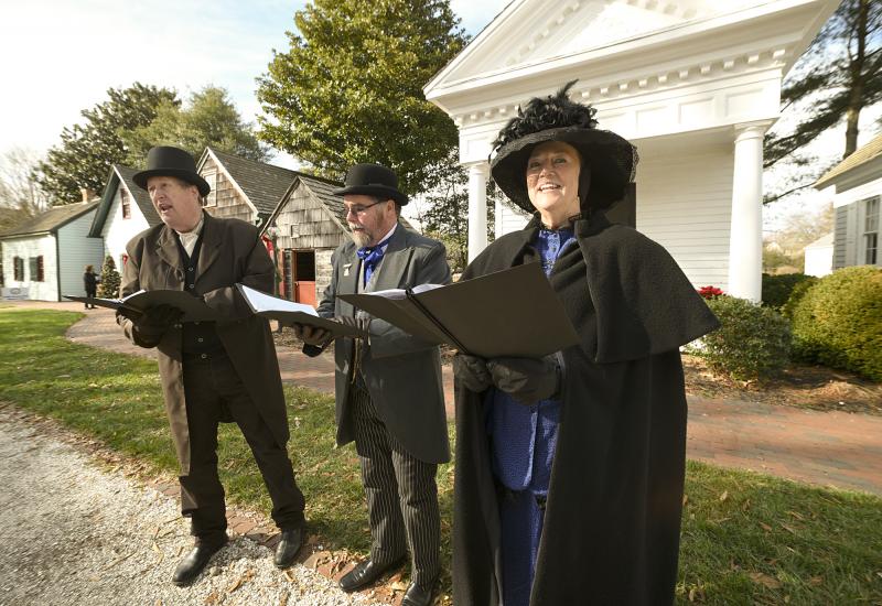 Carollers entertain guests at the LHS historic campus. Shown singing are Scott Lackman, Bill Hicks and Jill Hicks.