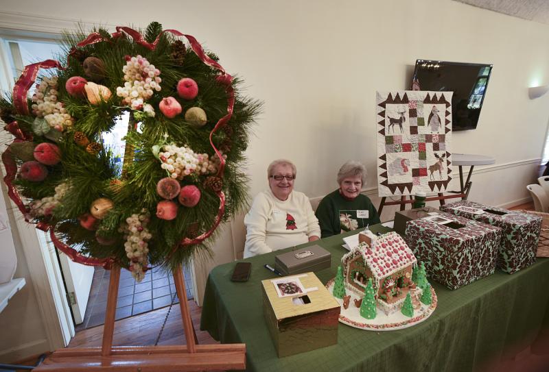 Georgette Renault and Patty Warden are selling chances for several creative items at St. Peter’s Hot Soup Luncheon.
