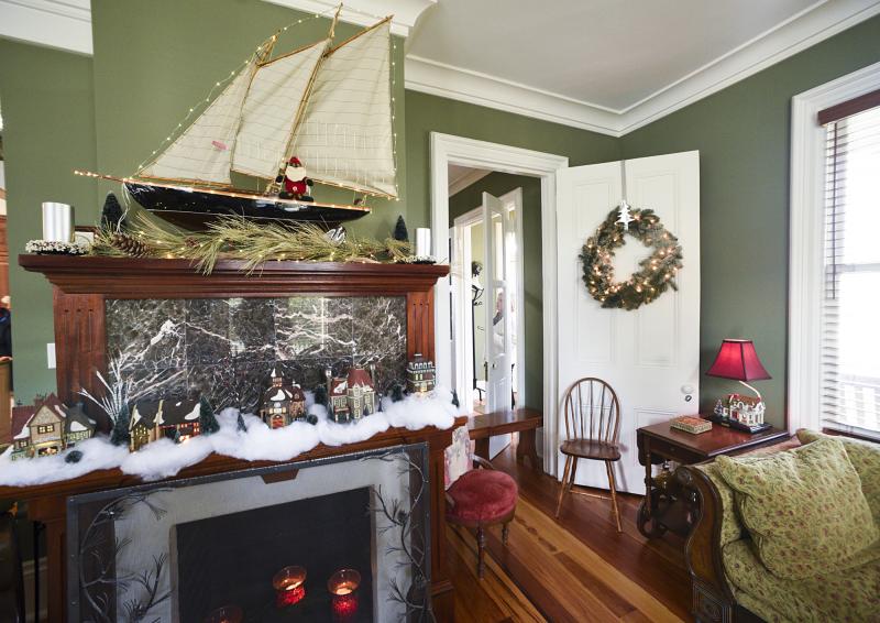 This Shipcarpenter Square home, originally built by a ship captain, gets a nod to its history with a sailing vessel on its decorated original mantel.