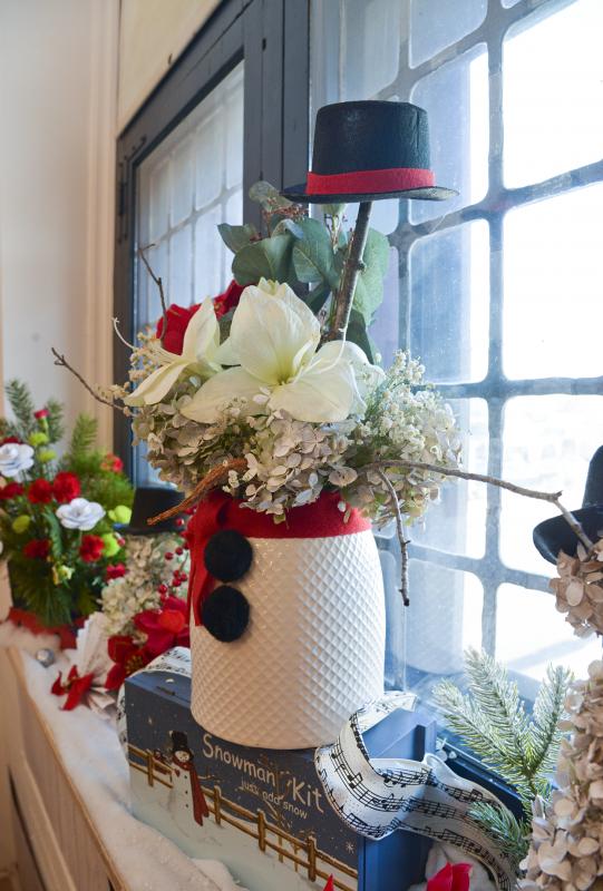 The Sussex Master Gardeners decorated the Zwaanendael Museum with a musical holiday theme. Here is a deconstructed snowman featuring hydrangeas and a dried carrot for a nose.