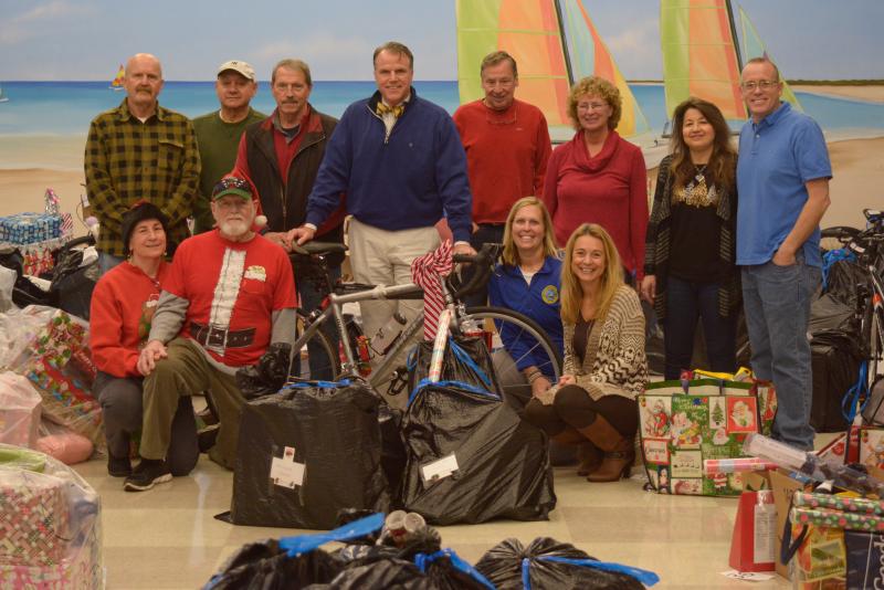 Cape community caring volunteers helped organize the gifts at The Crossing. Shown are in back (l-r) Rich Corbit, John Ciano, Mike McGuire, Bob Fulton, Julio Infiesta, Norma Johnson, Dawn Bell, and Drew Mobius. In front are Toni Walton, Larry Walton, Shawna Steinmann, and Jenny Nauman. SUBMITTED PHOTO