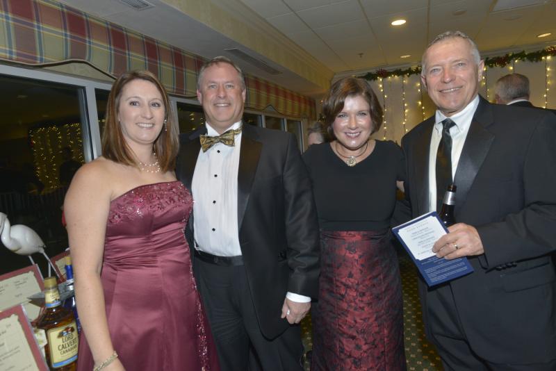 Enjoying the festive atmosphere at the silent auction are (l-r) Rachel and Chris Benjamin, Laurie Harper and Tim King. Harry K Christmas Ball 2019
