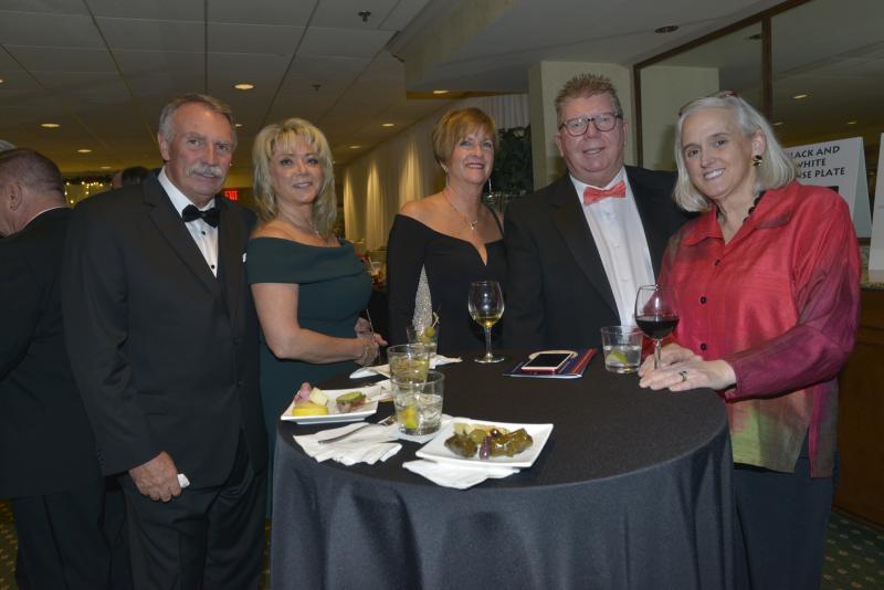 Enjoying the event with Delaware’s First Lady Tracey Quillen Carney are (l-r) Bob Bunting, Brenda Richards, Beth Einstein, Bill Hinderer and Quillen Carney. Harry K Christmas Ball 2019