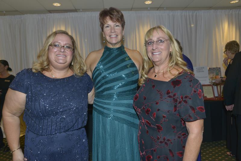 Chatting at the event are (l-r) Jeri Goetz, Harry K Foundation Executive Board Member Tish Berry and Board Member and VIA Liaison Laurie Meacham. The VIA was a large presence at the ball, volunteering in various capacity. Harry K Christmas Ball 2019