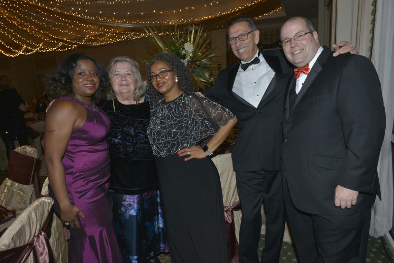 Harry K partners from Food Bank of Delaware. shown are (l-r) Iskeisha Stuckley, Patricia Beebe, Naty Moreta-Wright, Don Beebe and Chad Robinson. Harry K Christmas Ball 2019