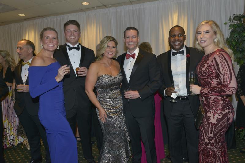 Enjoying the company of friends are (l-r) Rebecca and Clayton Serman, board members Alice and Chris Rausch, and Preston and Caitlin Russell. Harry K Christmas Ball 2019