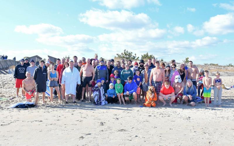 Nearly 70 Polar Bears jumped into the 43-degree Atlantic Ocean at the Cape Henlopen State Park to celebrate 2020. DAN COOK PHOTOS