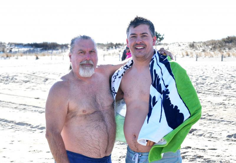 Veteran Polar Bear Bruce Egolf, left, and his son Bradley jumped together to celebrate the new year.