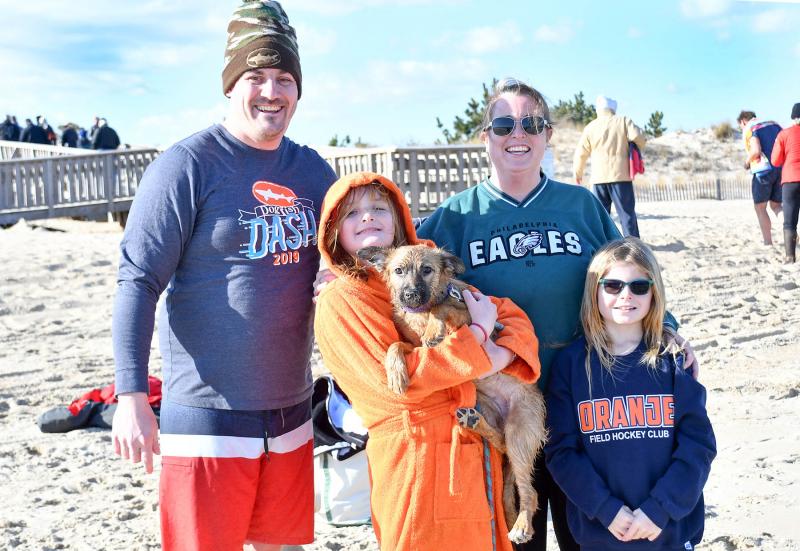 The family that Polar Bear plunges together .... Shown are (l-r) DJ, Leila (10), Lucy dog, Alison and Daisey (9) Hughes.