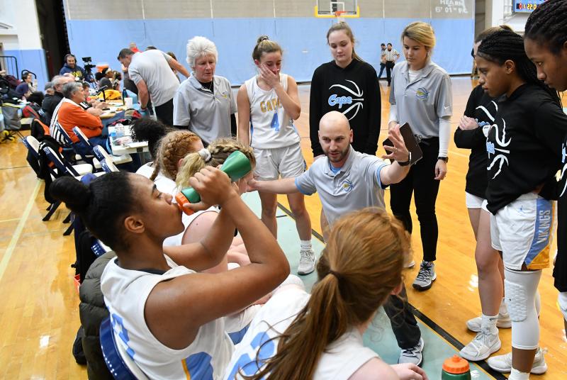 Cape head coach Pat Woods reviews a defense during a late fourth-quarter timeout.
