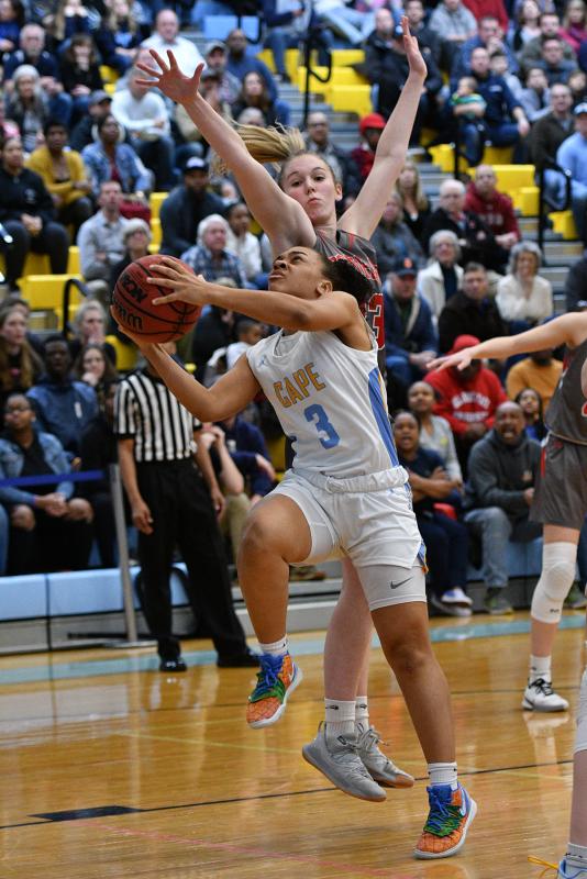 Dania Cannon goes up and under Conrad’s Julie Kulesza.