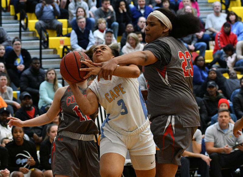 Dania Cannon gets fouled going to the hoop by Conrad’s Ja'Nylah Whittlesey.