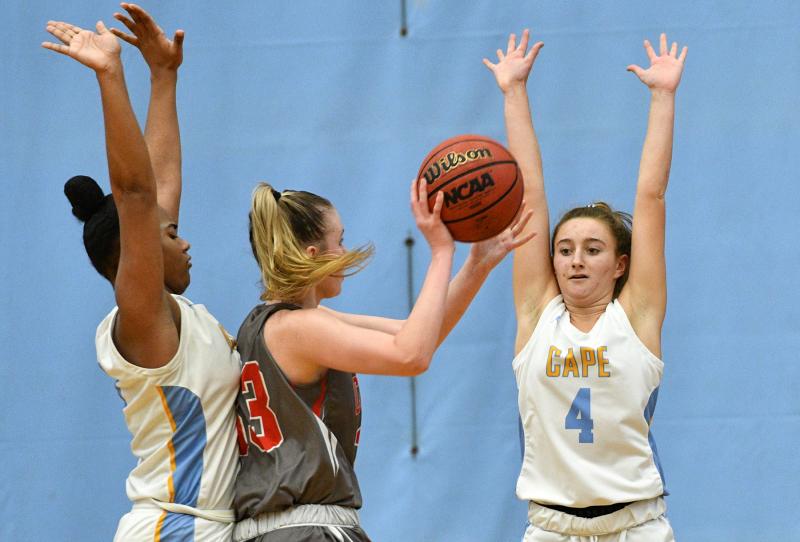 Cape guard Ella Rishko, right, and Mehkia Applewhite trap Conrad’s Julie Kulesza.