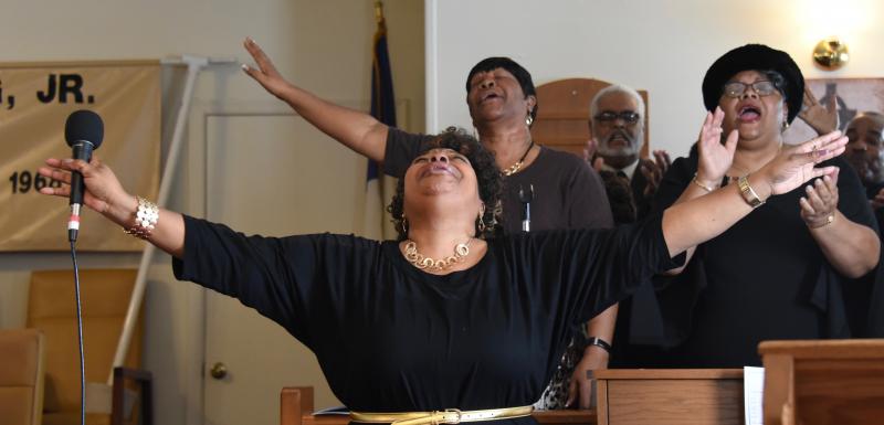 Members of the Mt. Zion Missionary Church Mass Choir get into the spirit of the Martin Luther King worship service. RON MACARTHUR PHOTOS