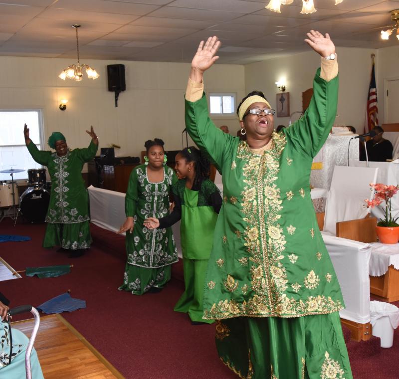 Higher Praize Ministry dancers perform during the service. They are front to back, Nicole Smith, Eviolet George, Denisha Purnell and Lorraine Smith.