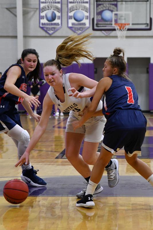 Delmarva Christian forward Sierra Troyer drives to the basket around Mallards senior Carly Hoffman.