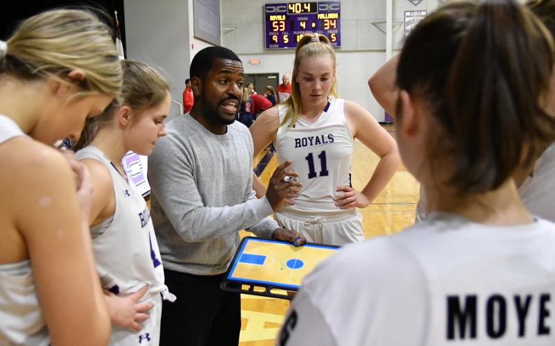 Royals coach Jedidiah Roach goes over third-quarter assignments.