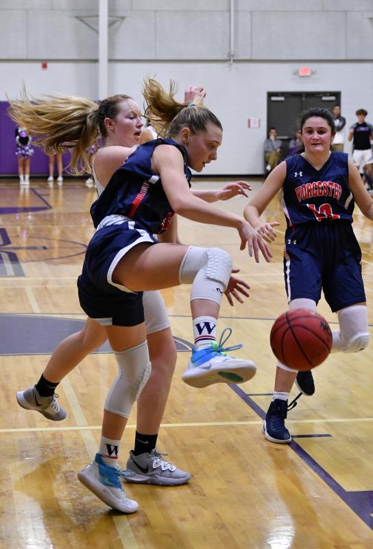 Worcester Prep sophomore Lily Baeurle battles for a rebound with Royals sophomore Sierra Troyer.