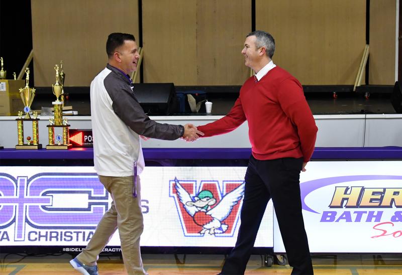Worcester head coach Brian McDermott, right, receives Coach of the Year kudos from Delmarva Christian Athletic Director Jim Berger.