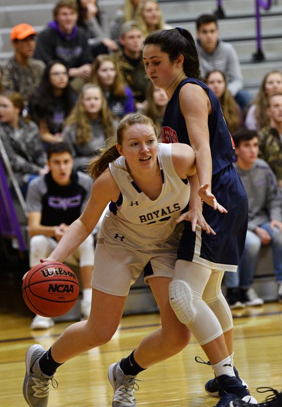 Delmarva Christian forward Sierra Troyer drives baseline on Mallards junior CC Lizas.