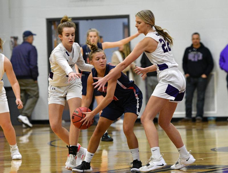 Royals Sara Walton, left, and Savannah Stewart trap Worcester’s Carly Hoffman.