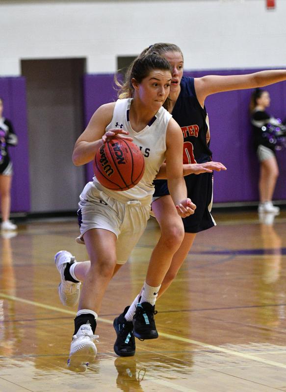 Royals junior point guard Grace Fetterman races the ball upcourt.
